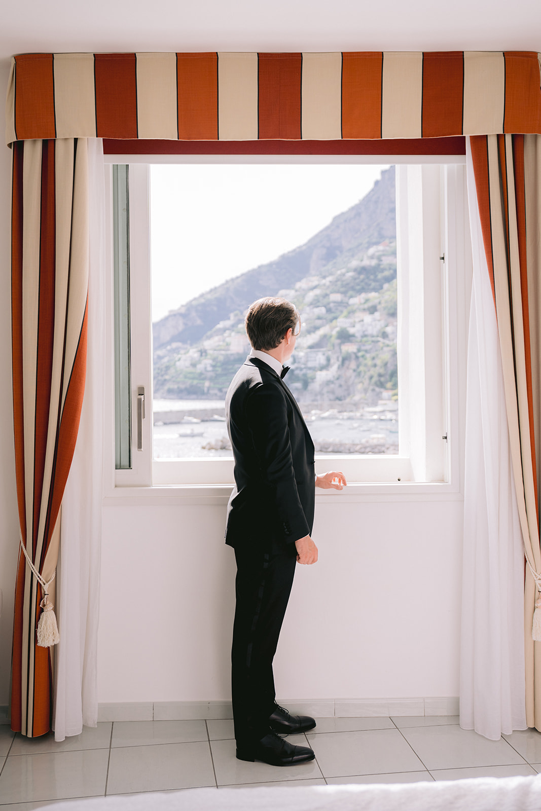 Andrea Gallucci - Destination Wedding Photographer- Amalfi Coast Positano Santorini Barcellona Rome Ravello Paris New York groom portrait with amalfi coast backdrop