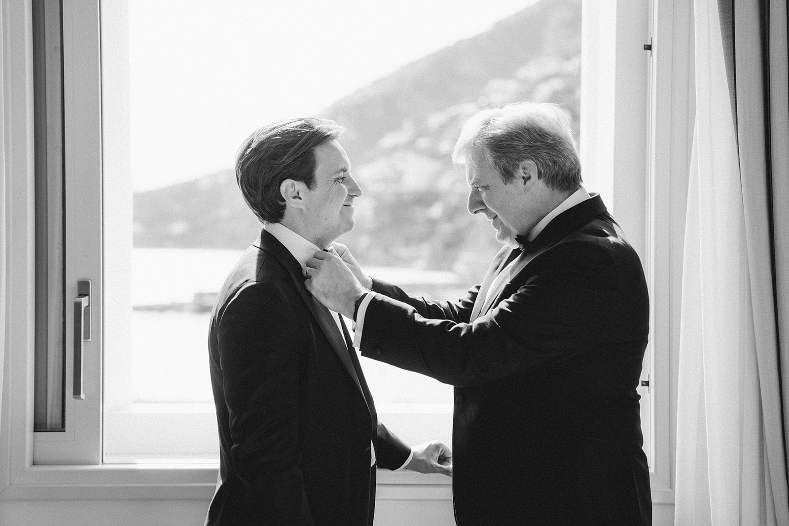 Andrea Gallucci - Destination Wedding Photographer- Amalfi Coast Positano Santorini Barcellona Rome Ravello Paris New York father of the groom helping the groom get ready