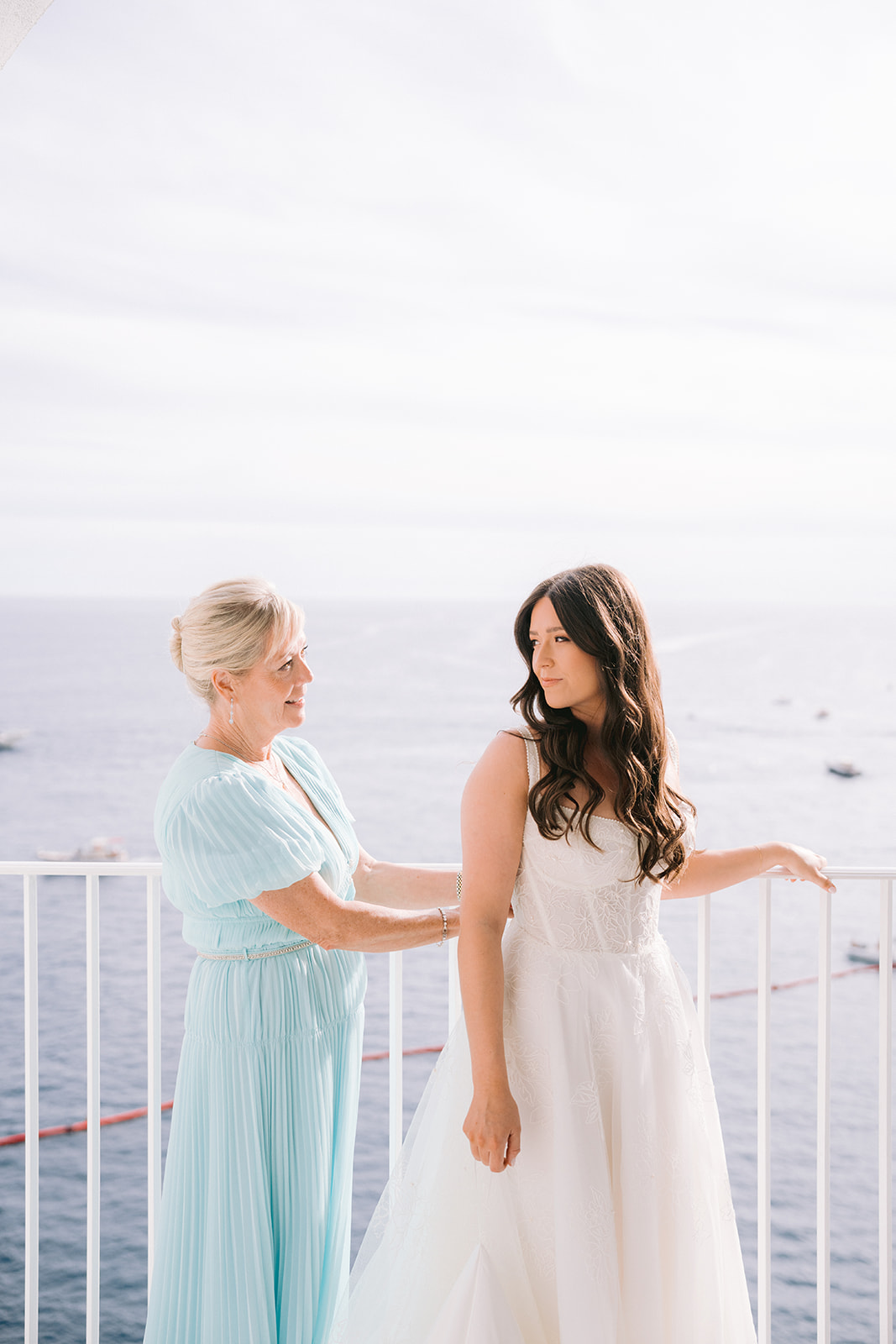 Andrea Gallucci - Destination Wedding Photographer- Amalfi Coast Positano Santorini Barcellona Rome Ravello Paris New York mother of the bride helping the bride get ready