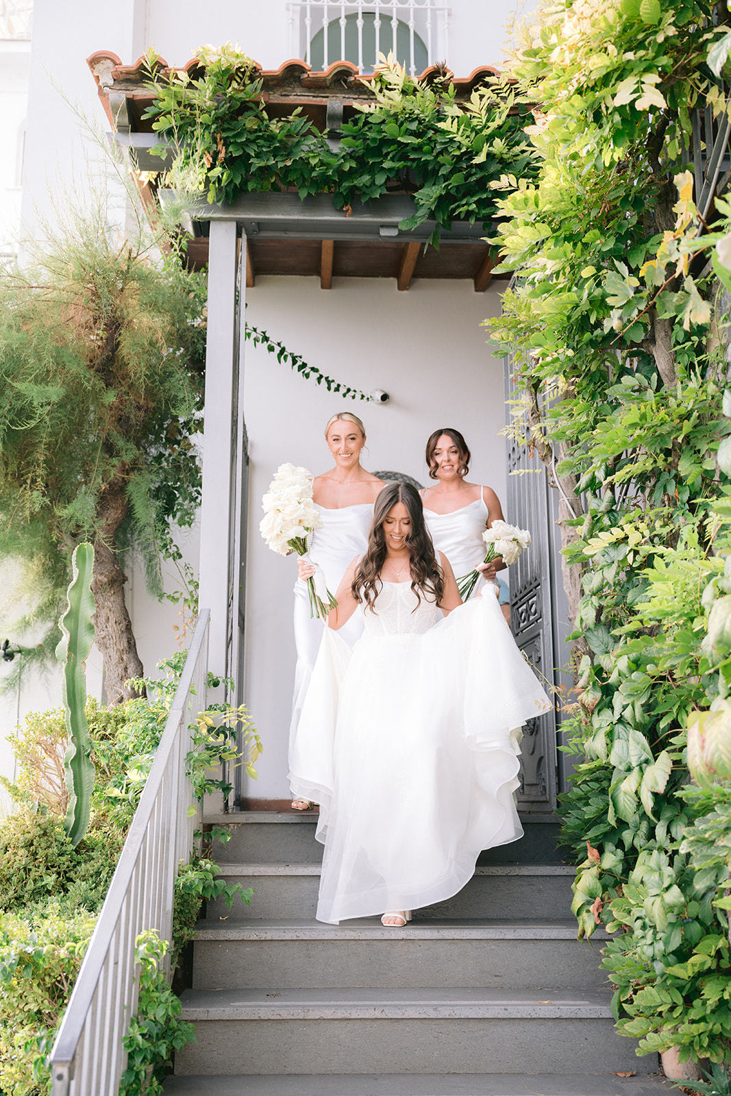Andrea Gallucci - Destination Wedding Photographer- Amalfi Coast Positano Santorini Barcellona Rome Ravello Paris New York candid wedding photos of bride and bridesmaids walking to the wedidng ceremony