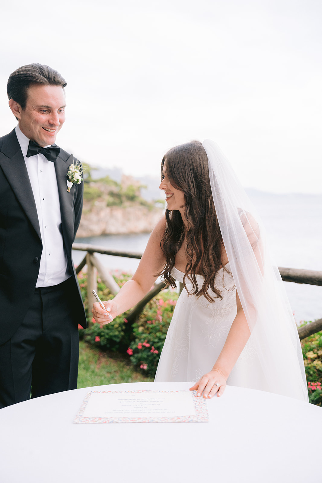 Andrea Gallucci - Destination Wedding Photographer- Amalfi Coast Positano Santorini Barcellona Rome Ravello Paris New York bride signing the paper to be officially married