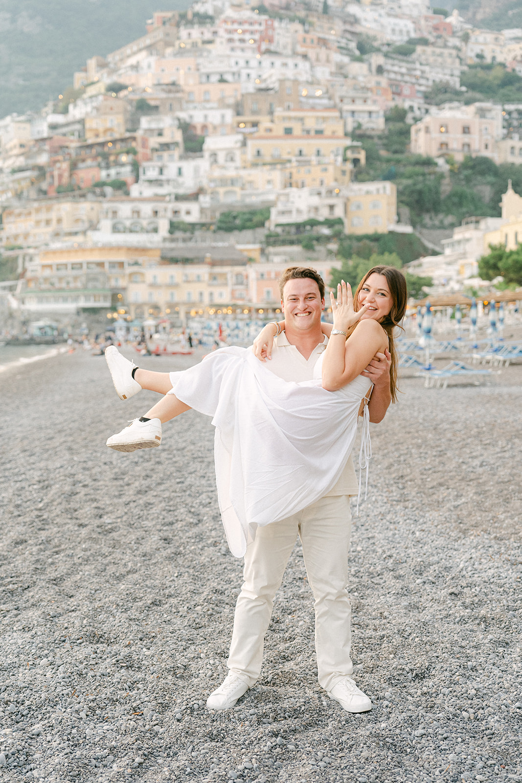Andrea Gallucci - Destination Wedding Photographer- Amalfi Coast Positano Santorini Barcellona Rome Ravello Paris New York fun engagement poses on the beach