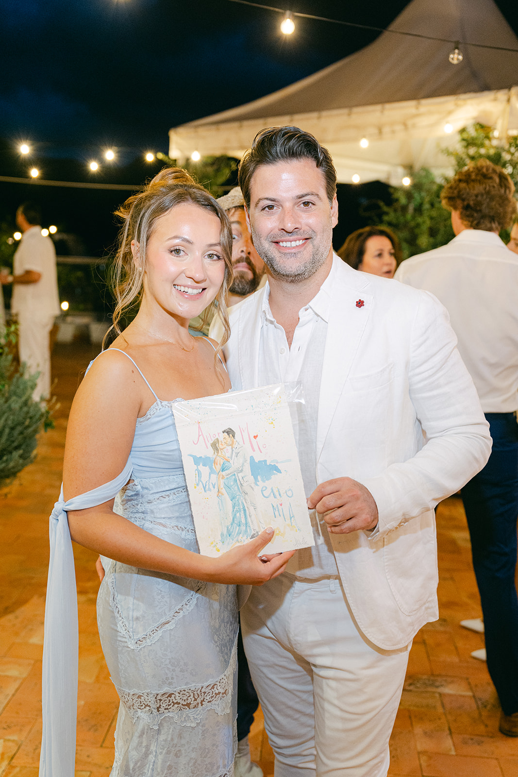 Andrea Gallucci - Destination Wedding Photographer- Amalfi Coast Positano Santorini Barcellona Rome Ravello Paris New York the wedding couple with their watercolor painting!