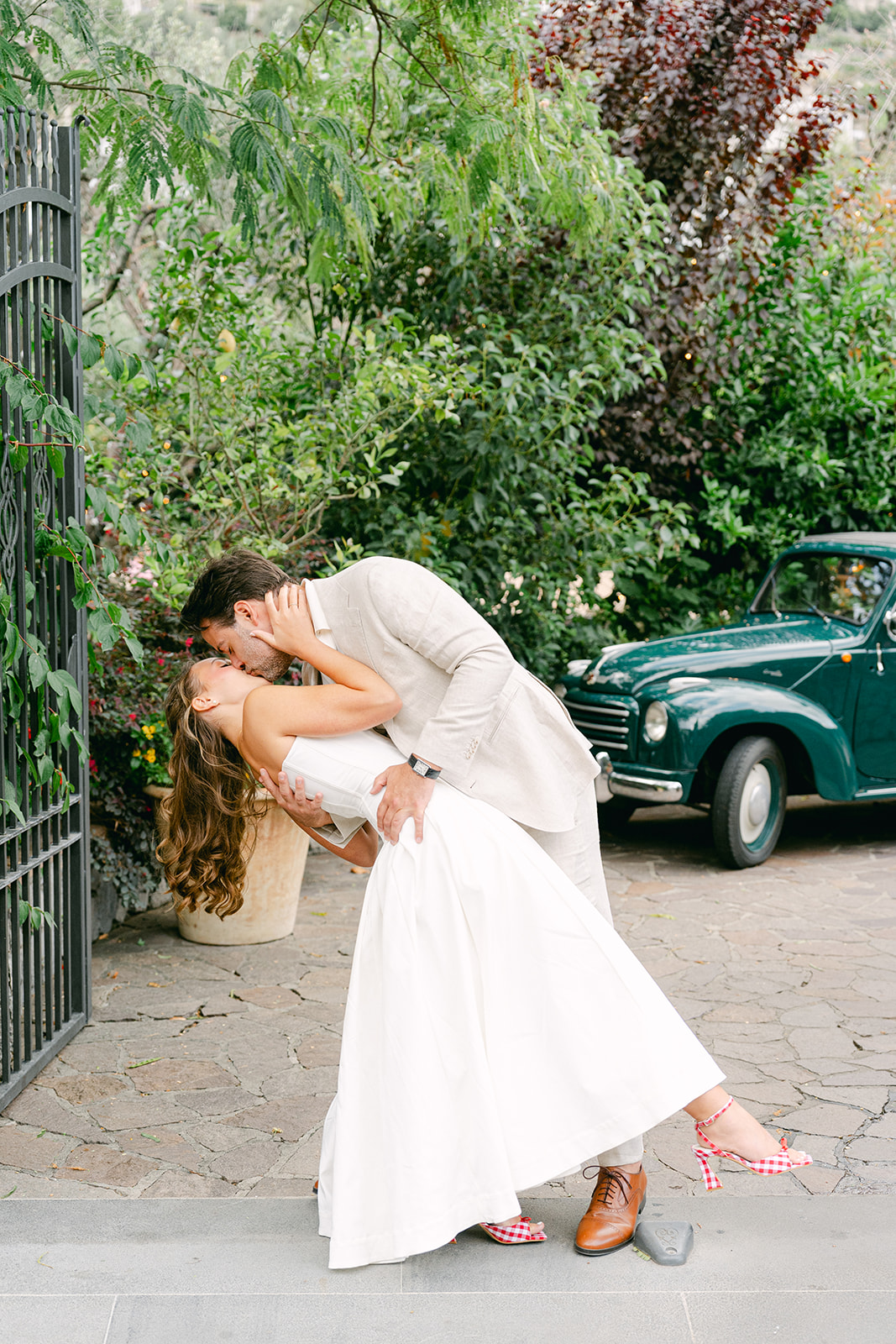 Andrea Gallucci - Destination Wedding Photographer- Amalfi Coast Positano Santorini Barcellona Rome Ravello Paris New York bride and groom kissing for their wedding portraits