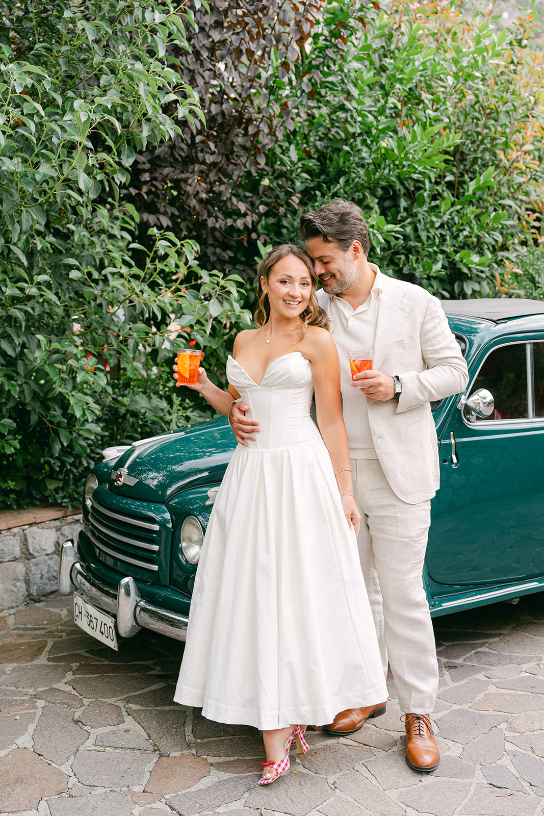 Andrea Gallucci - Destination Wedding Photographer- Amalfi Coast Positano Santorini Barcellona Rome Ravello Paris New York outdoor wedding photo of the bride and groom with their aperol spritz
