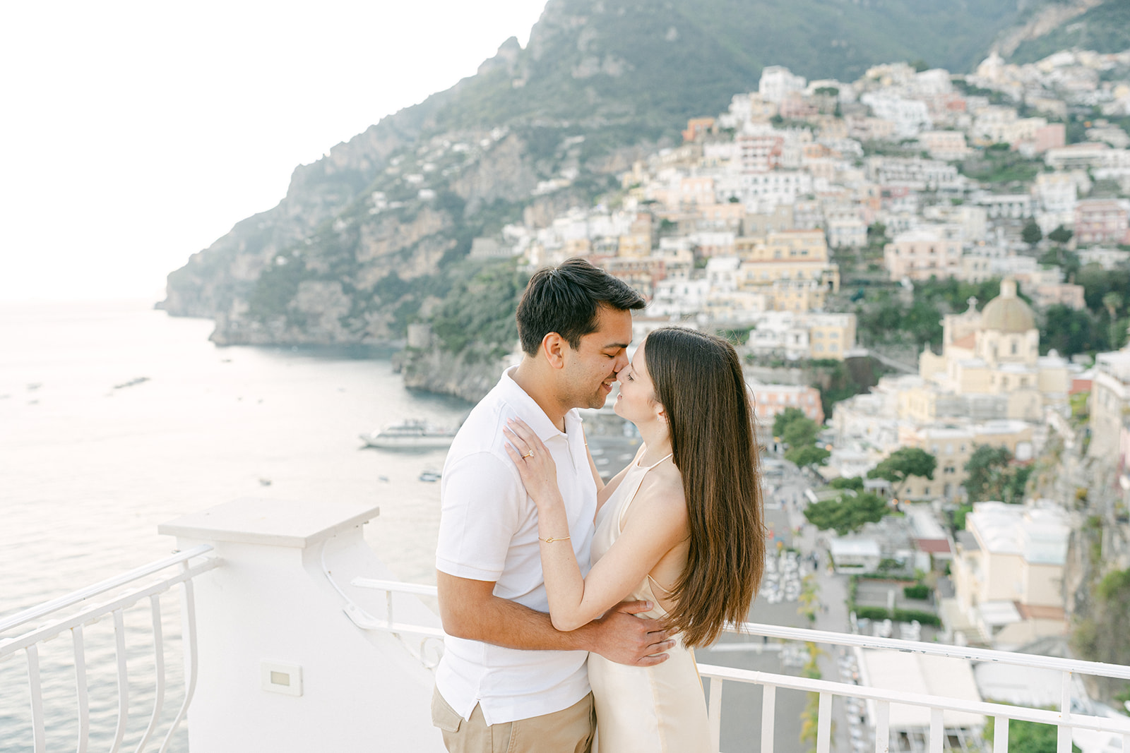 Andrea Gallucci - Destination Wedding Photographer- Amalfi Coast Positano Santorini Barcellona Rome Ravello Paris New York couple kissing for romantic engagement photo