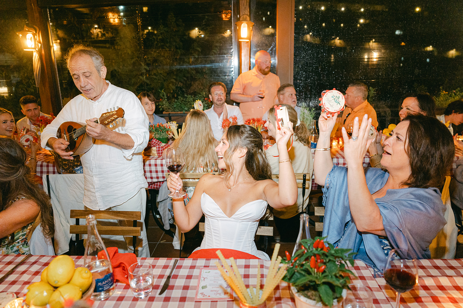 Andrea Gallucci - Destination Wedding Photographer- Amalfi Coast Positano Santorini Barcellona Rome Ravello Paris New York candid wedding photo of the bride and guests vibing to the live music
