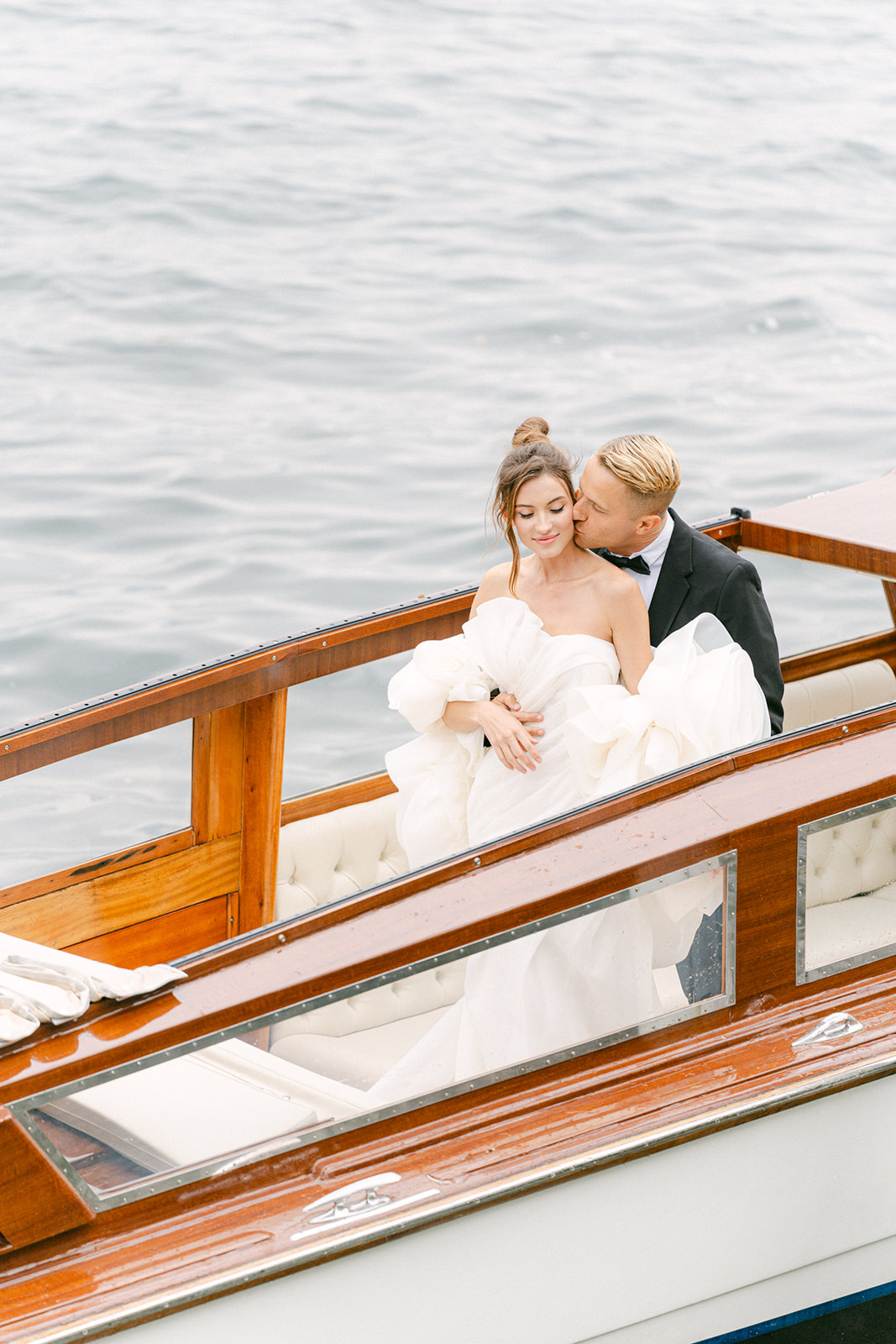 Andrea Gallucci - Destination Wedding Photographer- Amalfi Coast Positano Santorini Barcellona Rome Ravello Paris New York boat wedding photos of bride and groom in lake Como