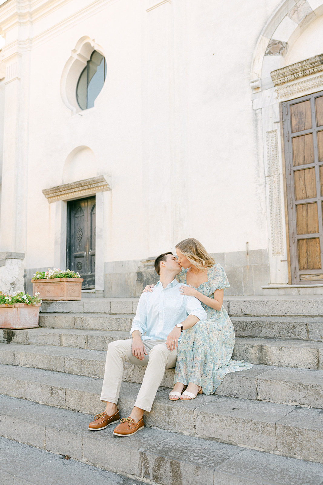 couple poses for summer engagement photoshoot