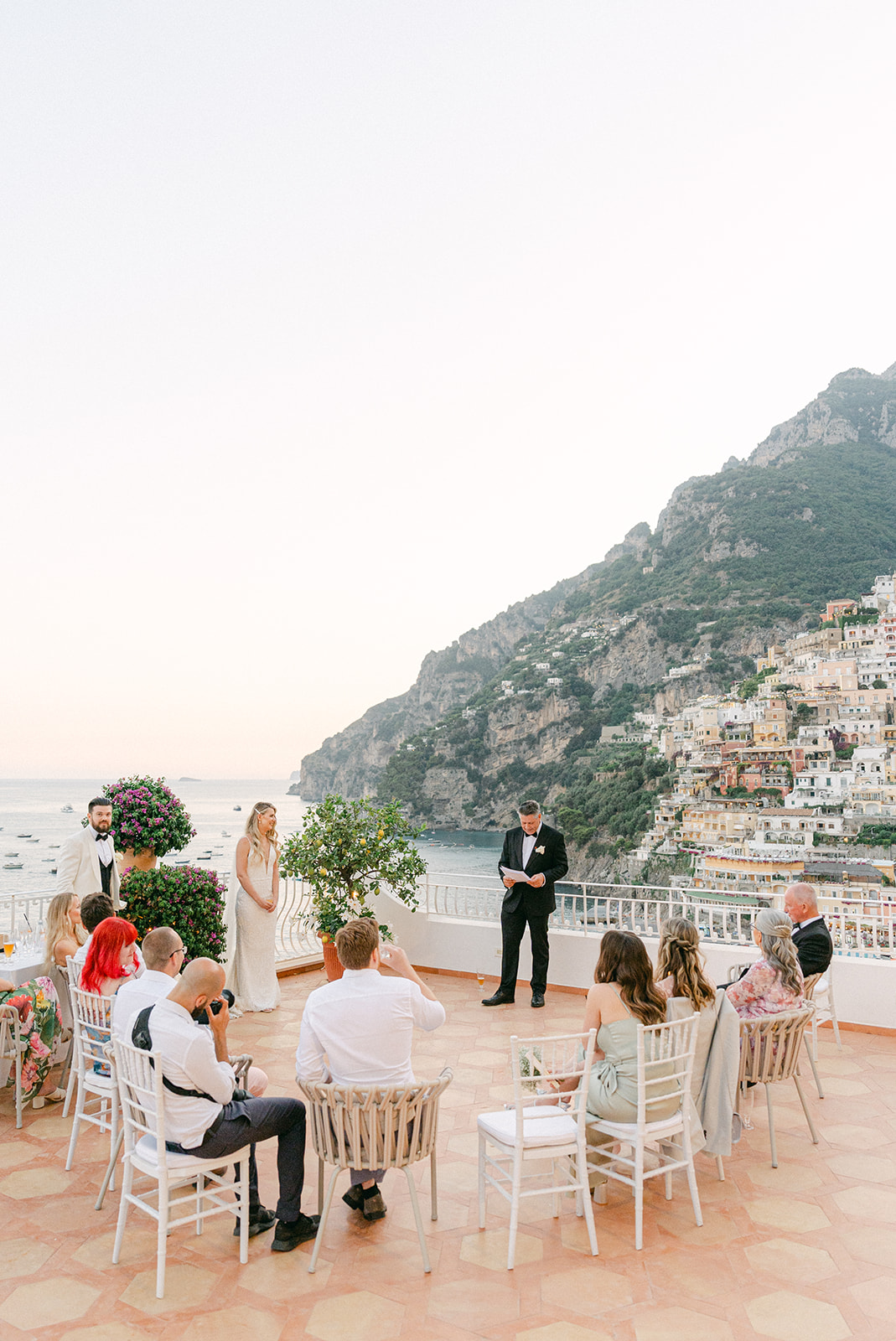 Andrea Gallucci - Destination Wedding Photographer- Amalfi Coast Positano Santorini Barcellona Rome Ravello Paris New York Father of the bride making a speech with Positano view in the background