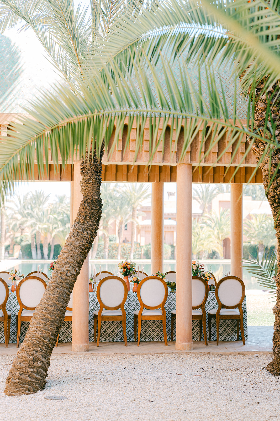 Reception table styling at a Morocco wedding with terracotta tones, and local florals