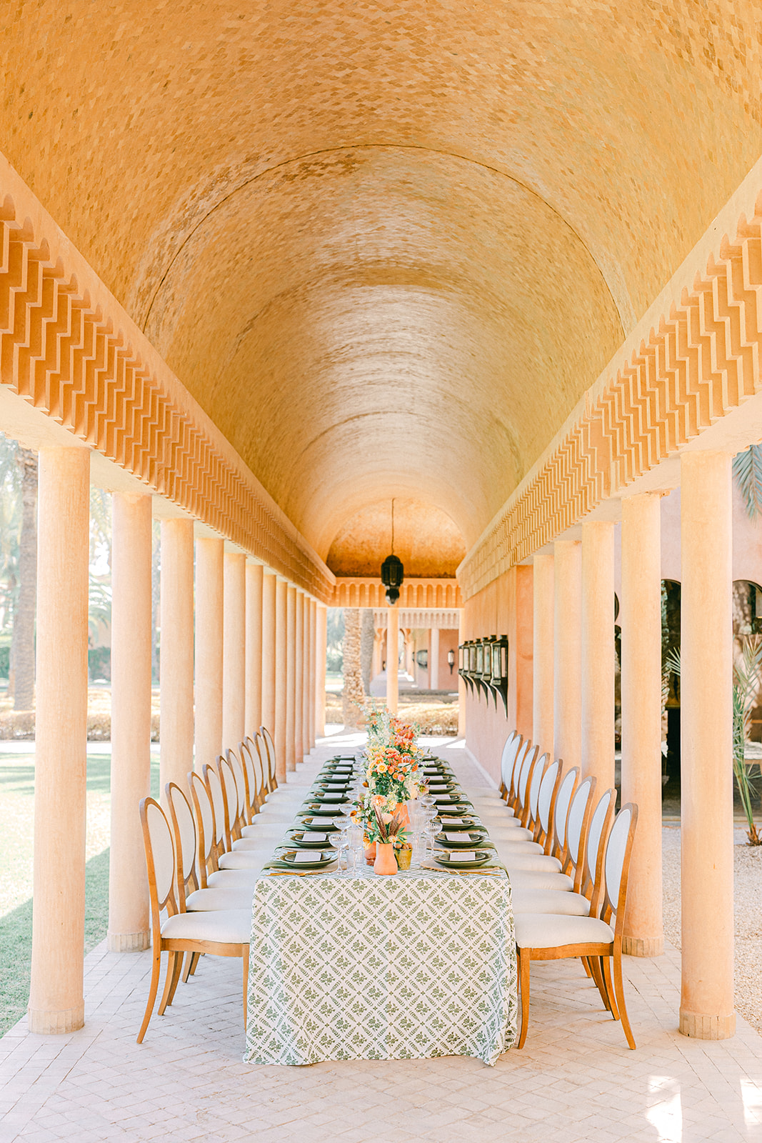 Unique table decor at Moroccan destination wedding featuring linen textures and palm trees