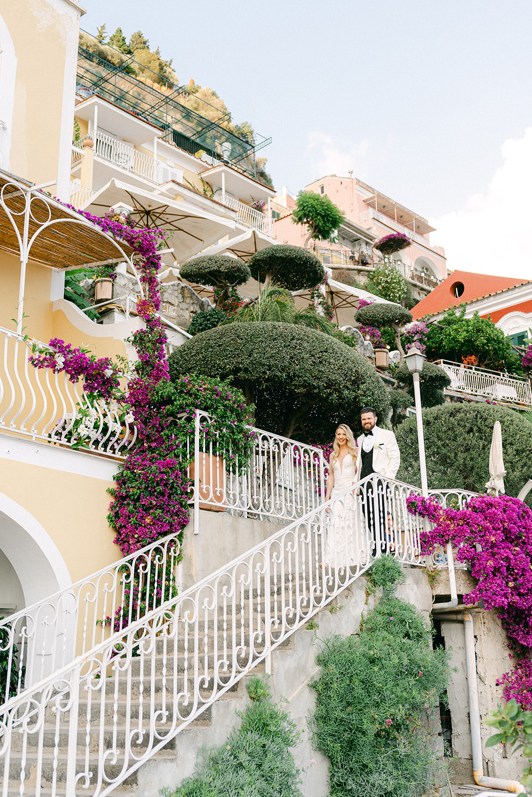 Andrea Gallucci - Destination Wedding Photographer- Amalfi Coast Positano Santorini Barcellona Rome Ravello Paris New York Bride and groom walking down the stairs to the terrace