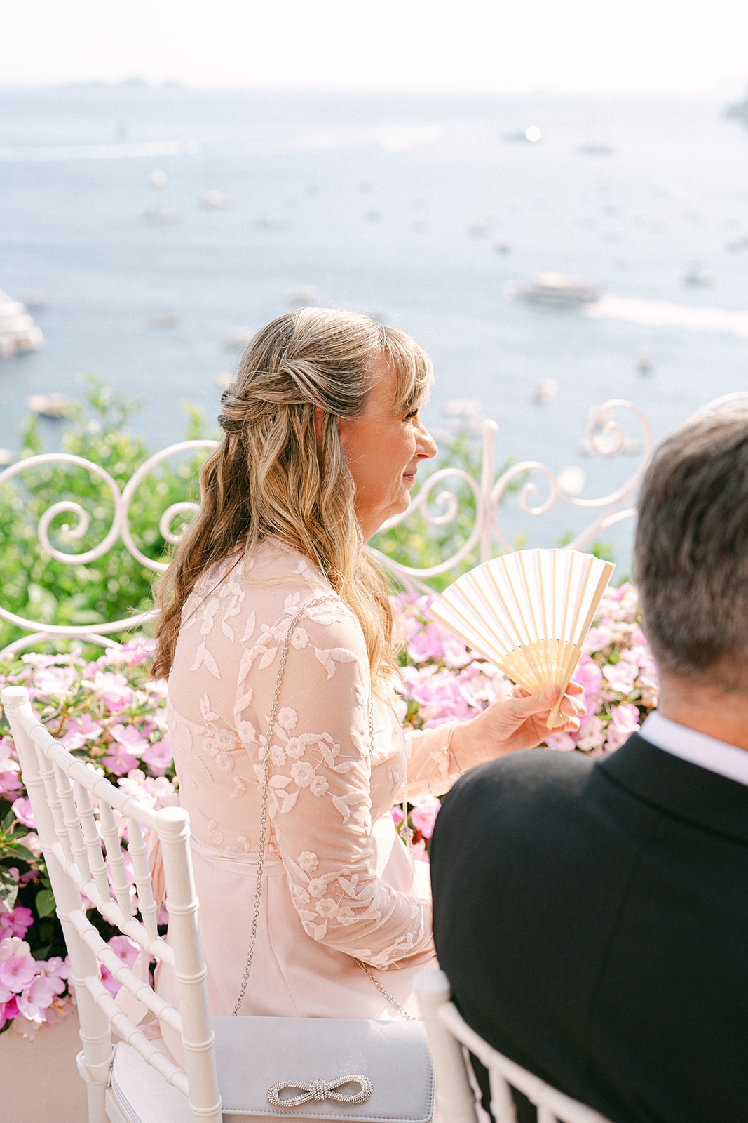Andrea Gallucci - Destination Wedding Photographer- Amalfi Coast Positano Santorini Barcellona Rome Ravello Paris New York Wedding guests seated at outdoor Positano ceremony