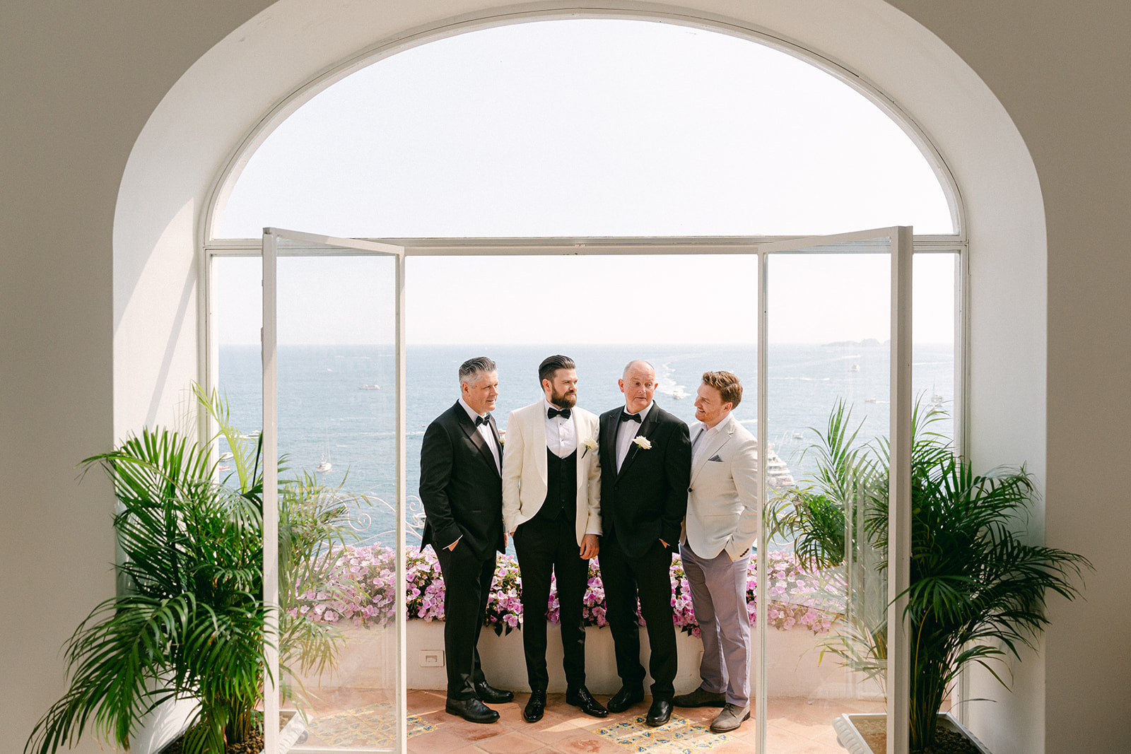 Andrea Gallucci - Destination Wedding Photographer- Amalfi Coast Positano Santorini Barcellona Rome Ravello Paris New York groom and groomsmen portrait with ocean views of Amalfi Coast