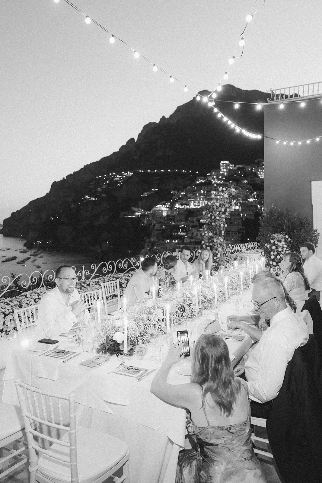 Andrea Gallucci - Destination Wedding Photographer- Amalfi Coast Positano Santorini Barcellona Rome Ravello Paris New York Reception setup with candles, florals, and ocean views