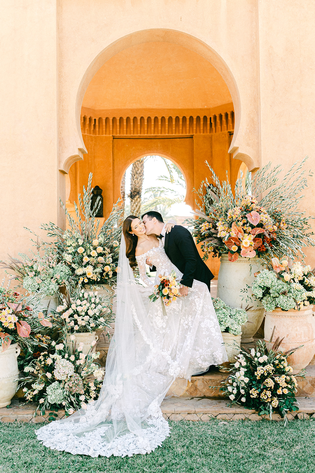 Styled wedding ceremony in Morocco with vibrant flowers and luxury resort backdrop