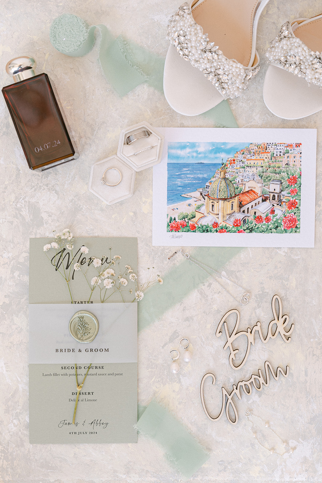 Andrea Gallucci - Destination Wedding Photographer- Amalfi Coast Positano Santorini Barcellona Rome Ravello Paris New York Flatlay of luxury wedding invitations and a Positano postcard