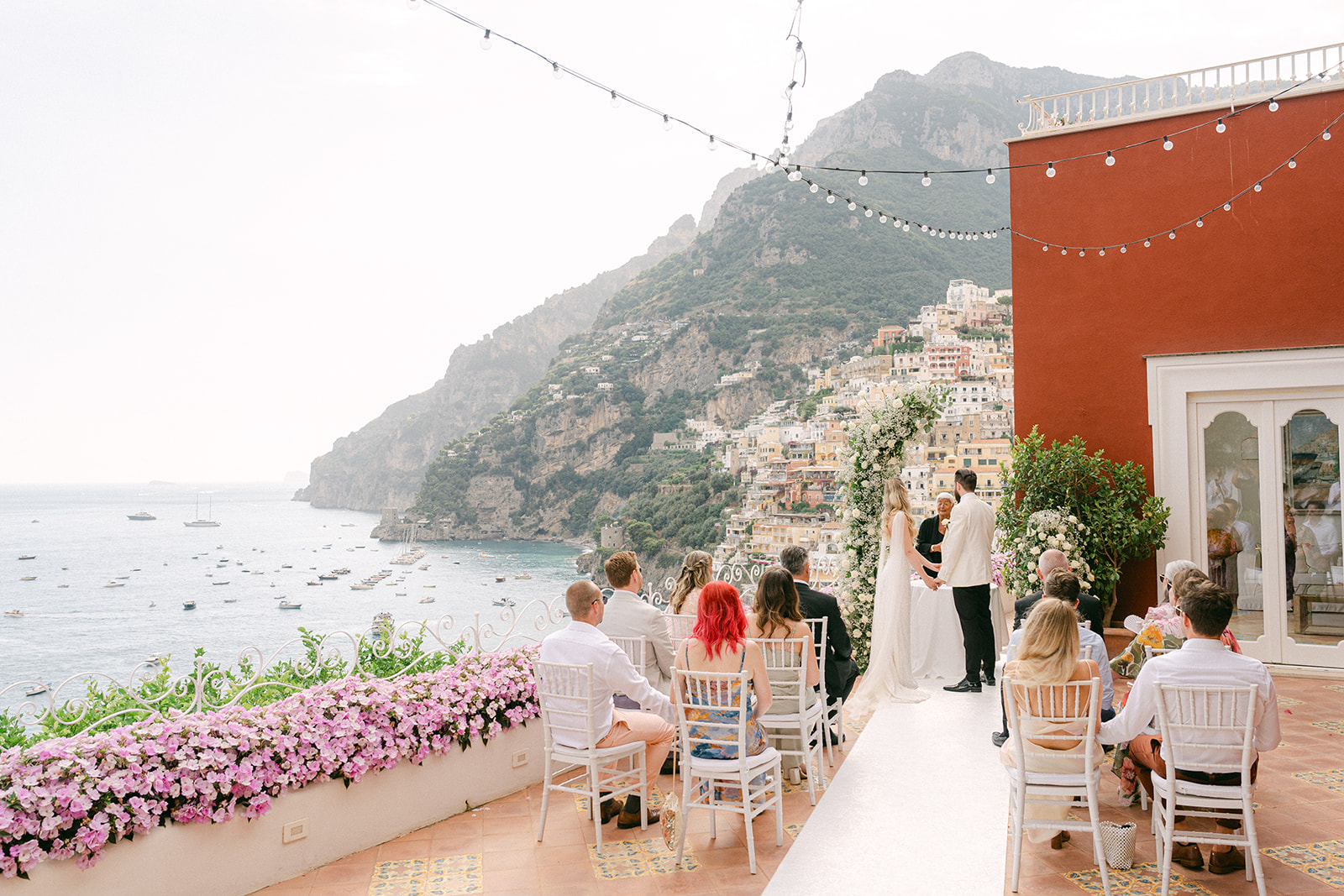 Andrea Gallucci - Destination Wedding Photographer- Amalfi Coast Positano Santorini Barcellona Rome Ravello Paris New York Positano wedding ceremony setup with ocean backdrop