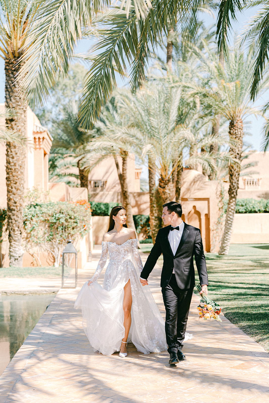 Candid moment between bride and groom at their Morocco wedding