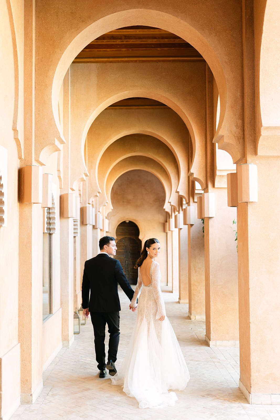 Candid wedding photo at Amanjena with Moroccan architectural
