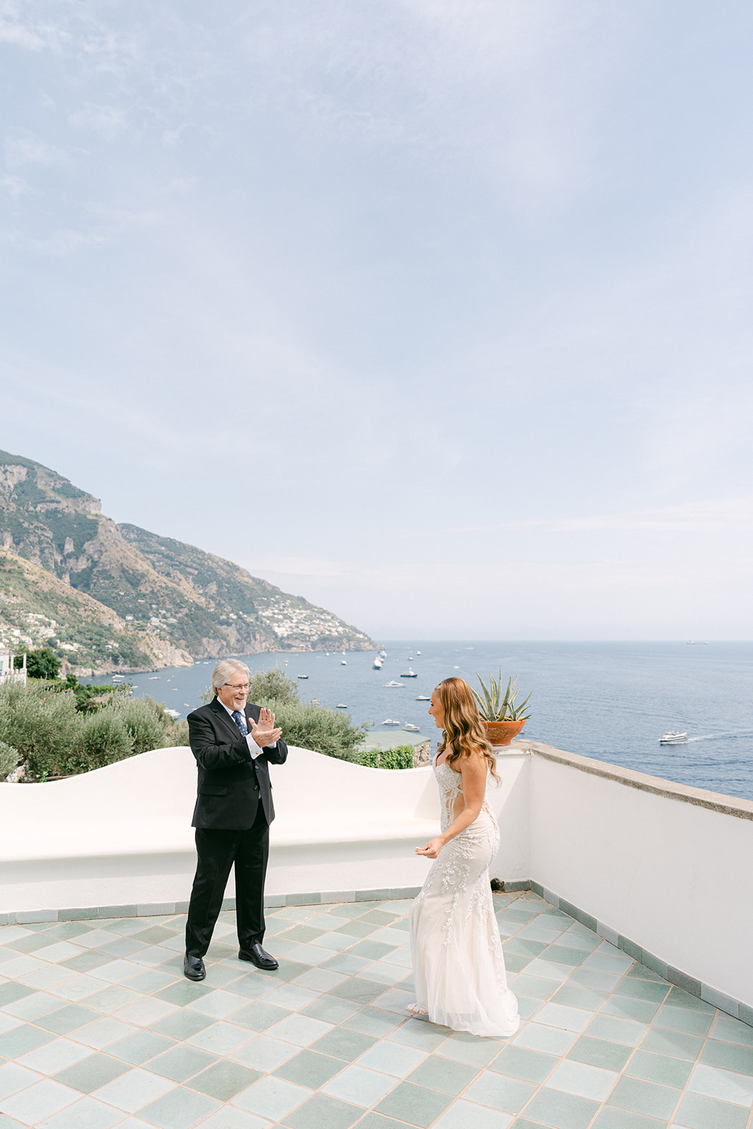Father seeing his daughter in her wedding dress for a first look in Italy