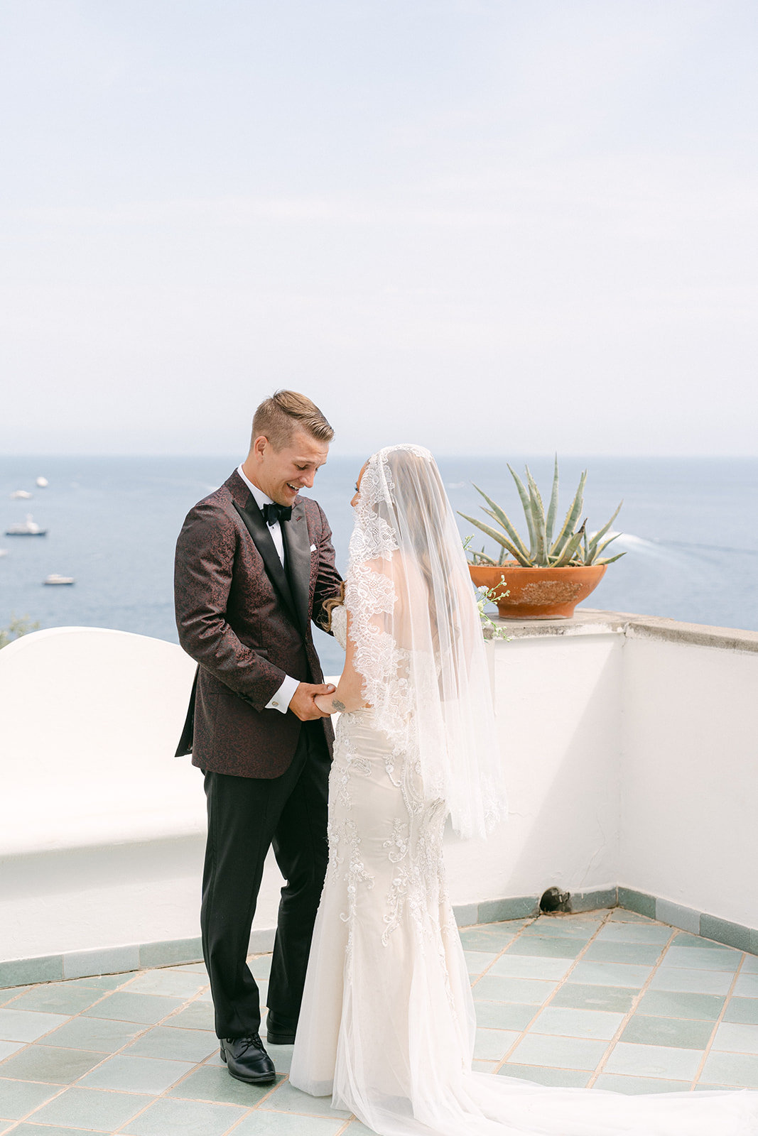 Groom tearing up during first look at a romantic Amalfi Coast villa in Italy