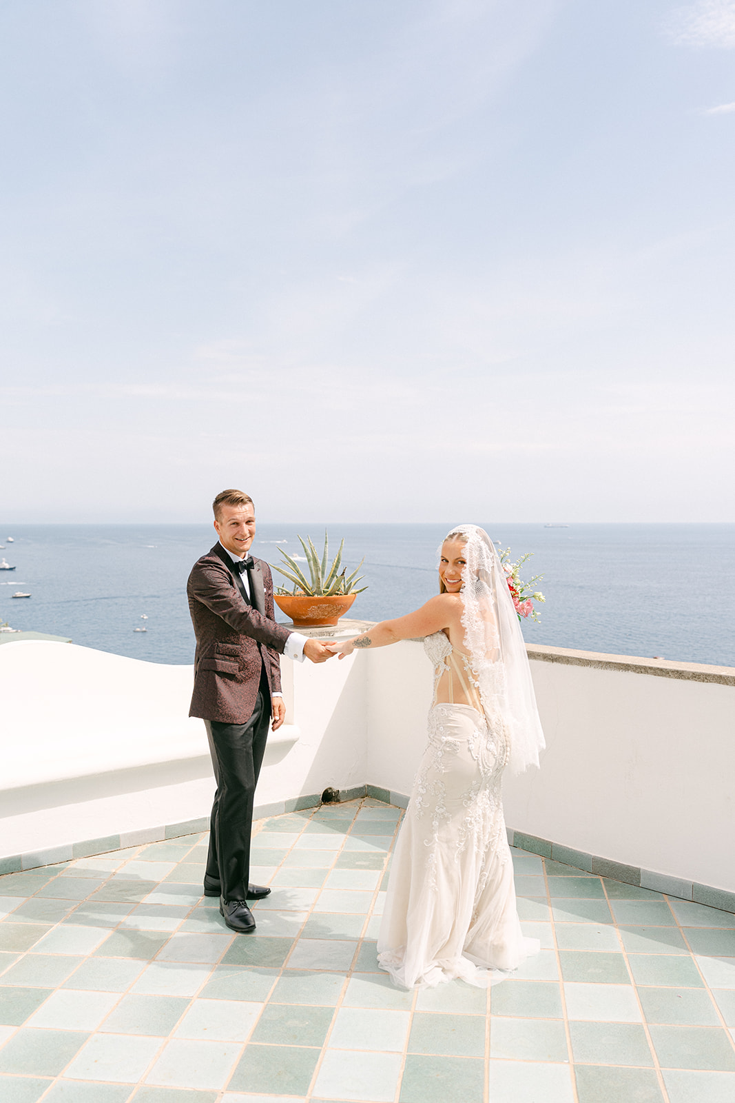 Bride smiling as she approaches her groom for their Amalfi Coast first look