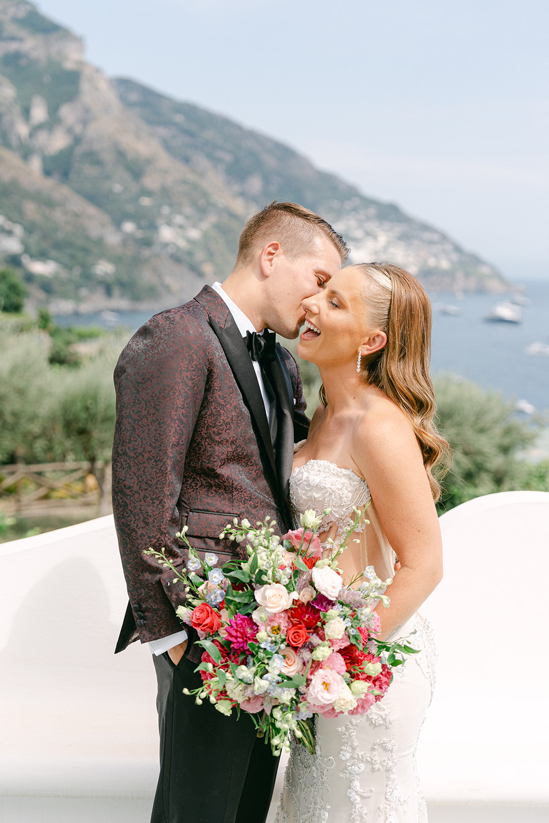 Joyful couple embracing during their first look
