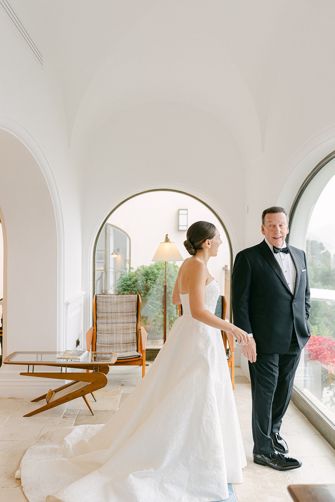 Emotional Amalfi Coast cliffside first look with bride and father of the bride before her wedding
