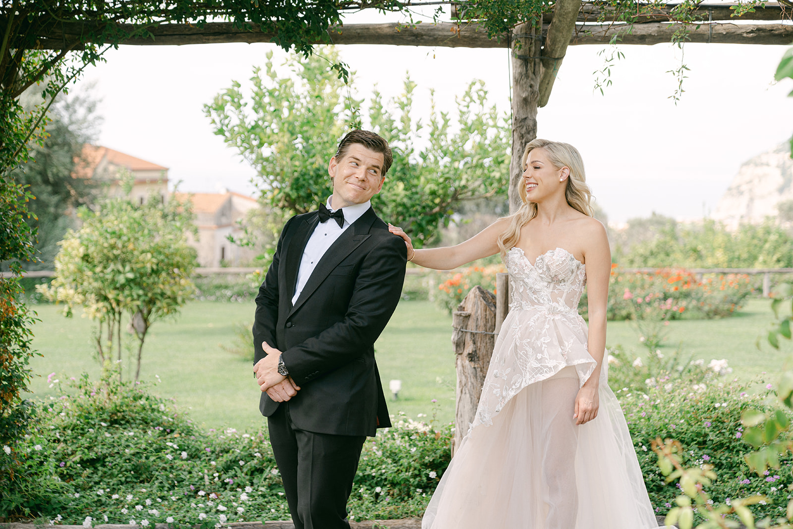 Groom turning around to see his bride for the first time at their Italy wedding