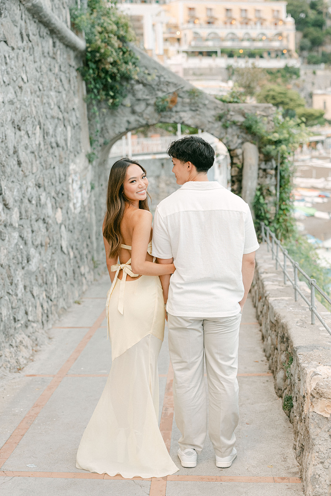 Couple walking along the Amalfi Coast during outdoor engagement photos