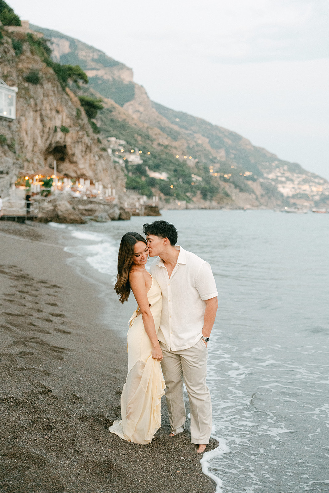 Outdoor engagement photos on Amalfi cliffside with ocean views