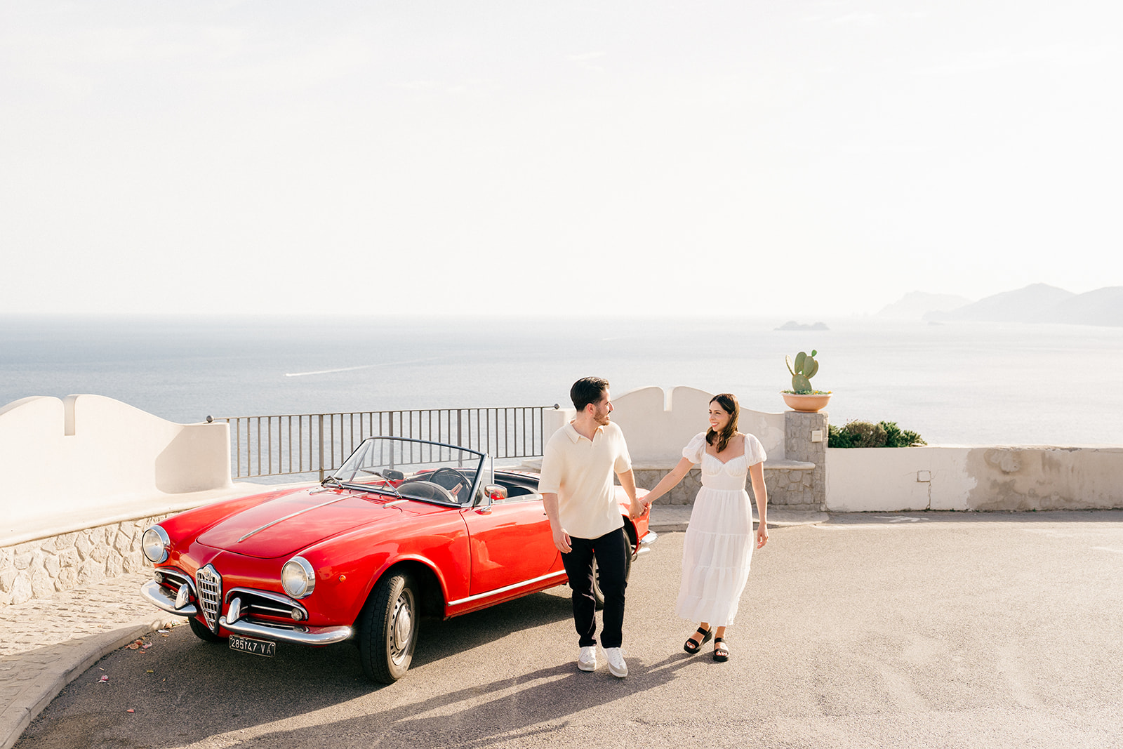 Couple holding hands during Amalfi Coast engagement shoot