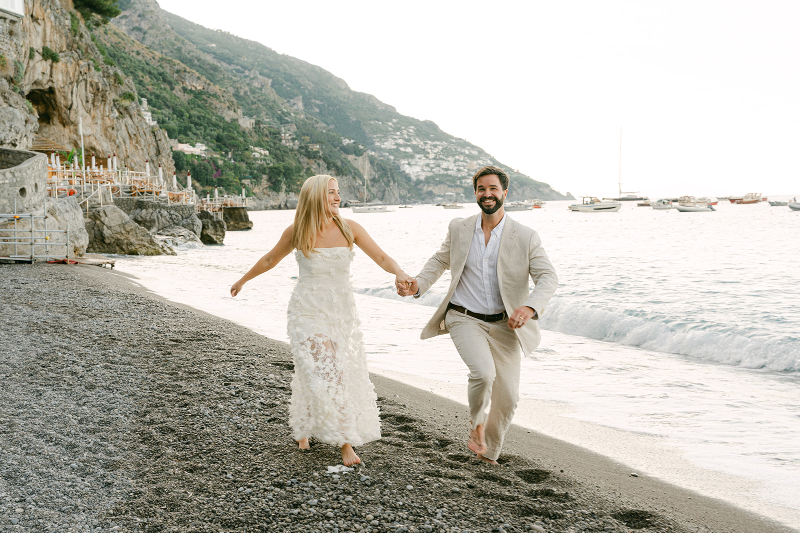 Candid outdoor engagement photos in Amalfi at the beach