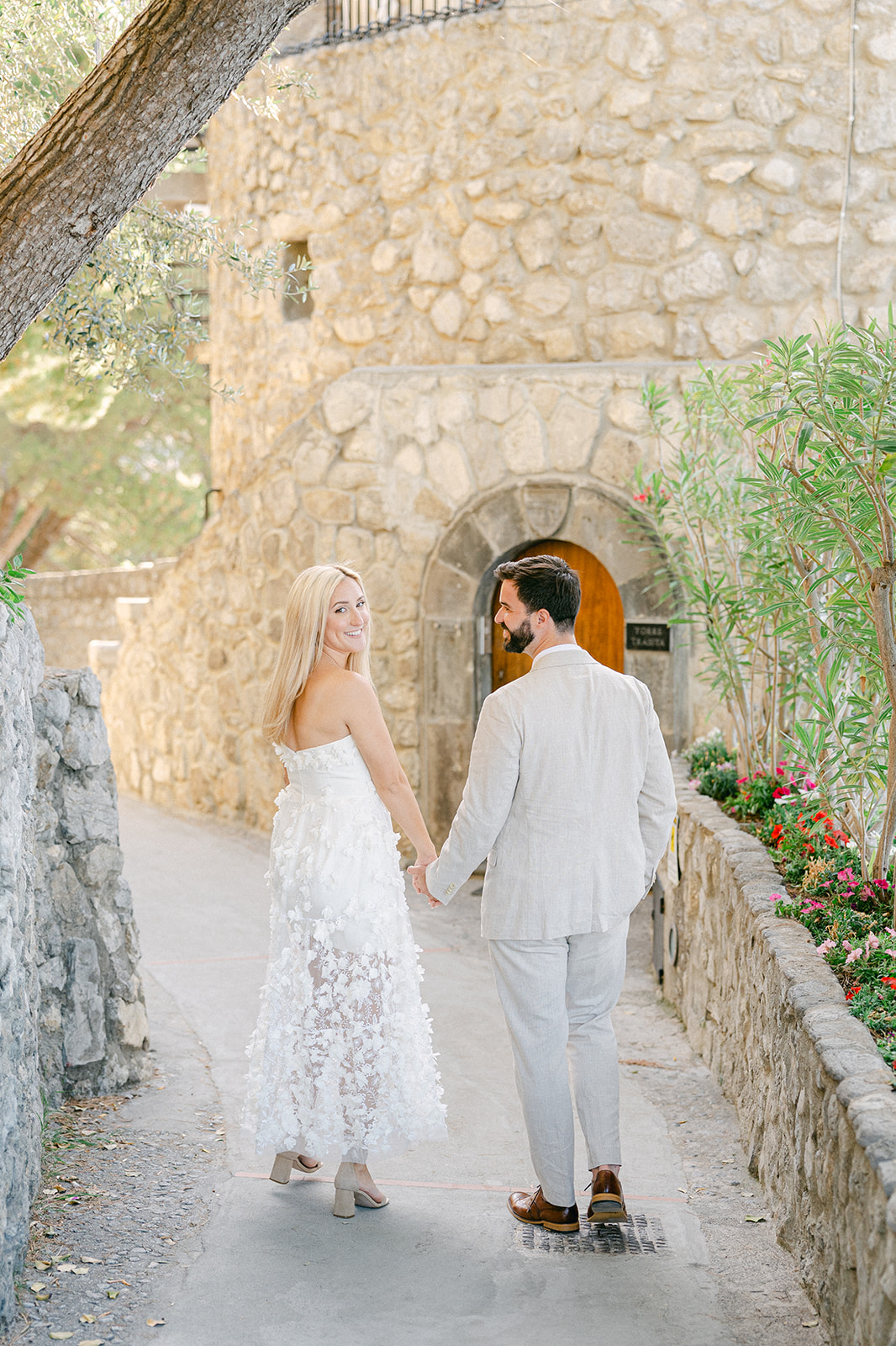 Couple walking narrow street during Amalfi Coast Italy engagement shoot