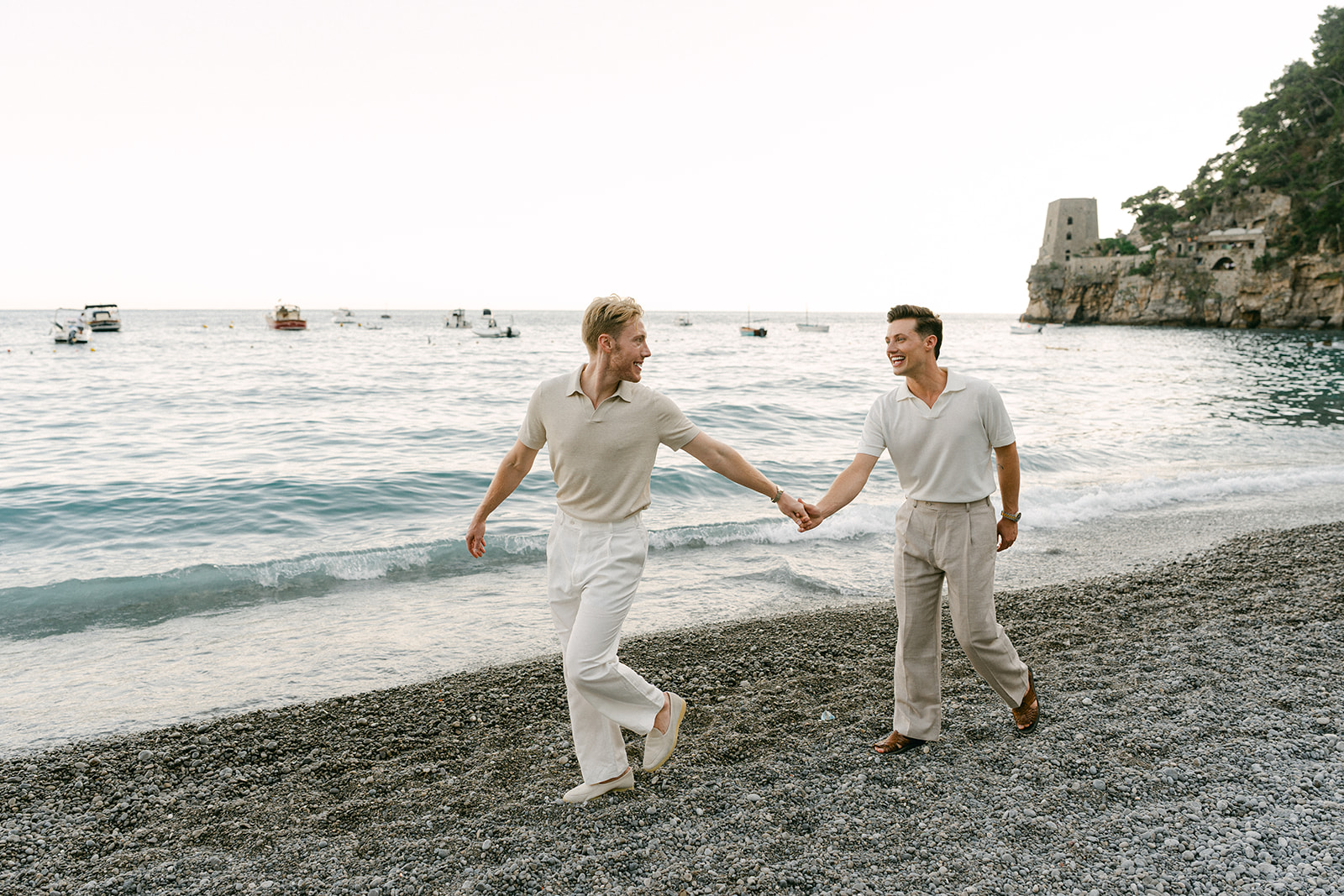 LGBTQ Couple walking hand in hand during outdoor engagement photos in Amalfi Coast