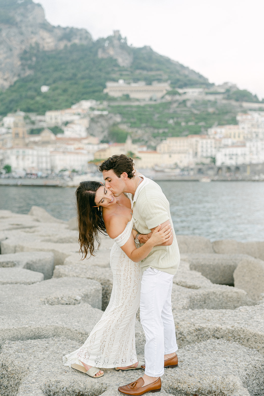 Outdoor engagement photo session with ocean cliffs in the background