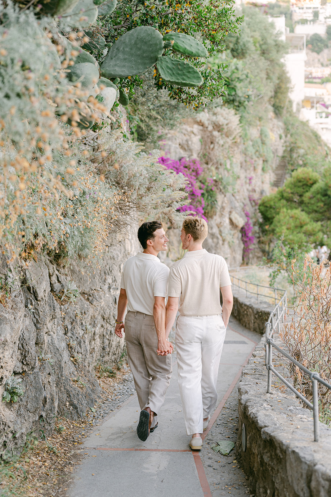 Same sex Couple enjoying a walk during outdoor engagement photos on Amalfi Coast
