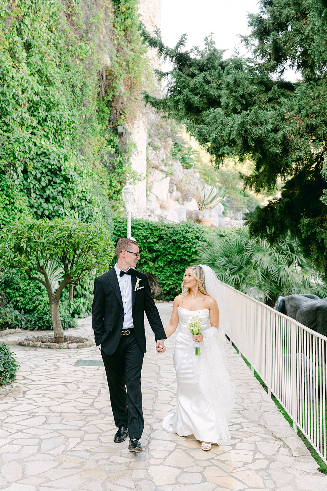 Couple celebrating their wedding in Èze with a view of the Mediterranean garden