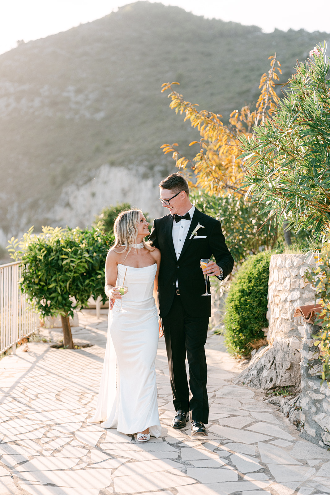 Couple walking through the gardens of Château de la Chèvre d’Or, France