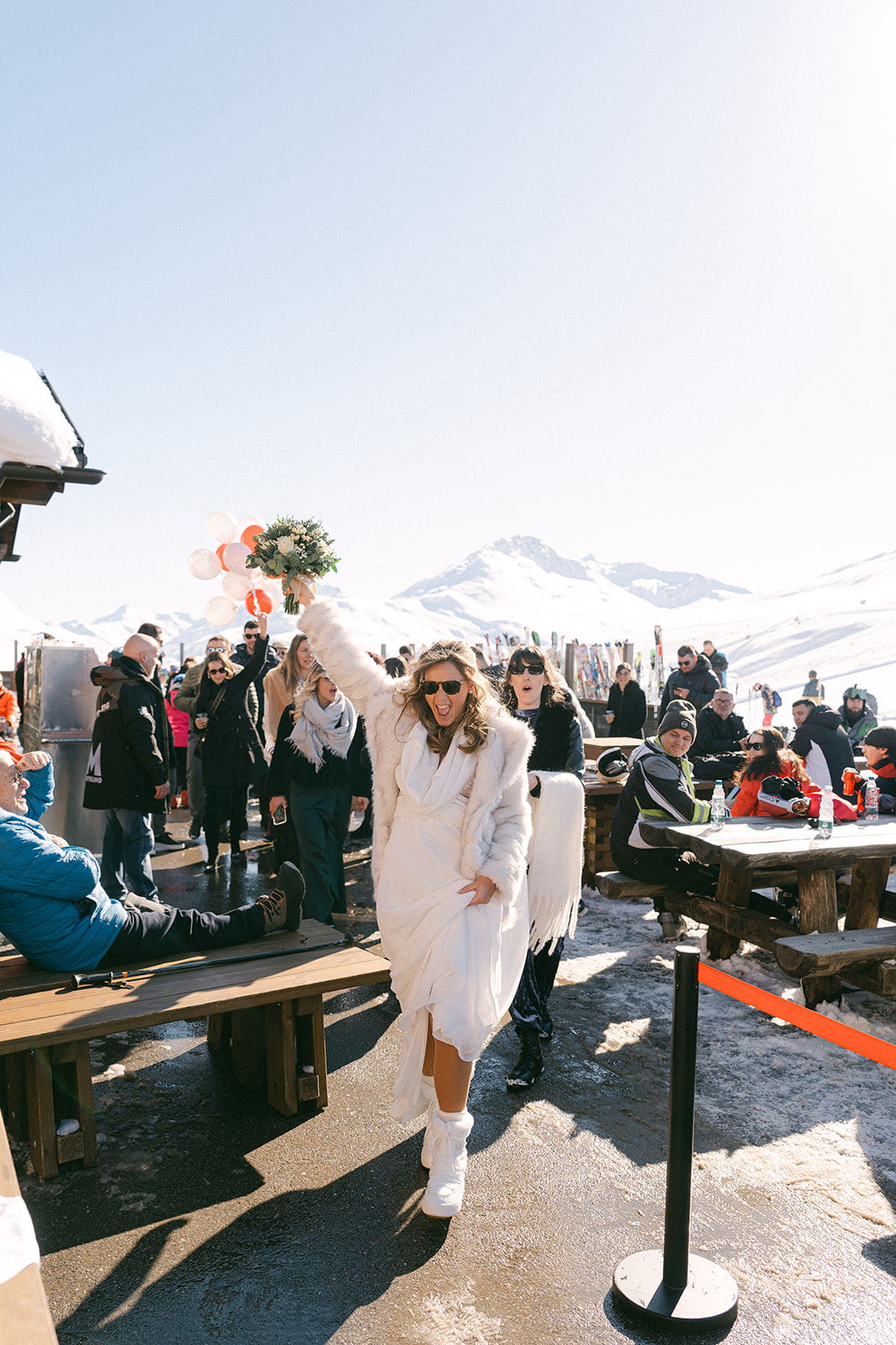 Bride holding bouquet outside a romantic chalet wedding in the Dolomites