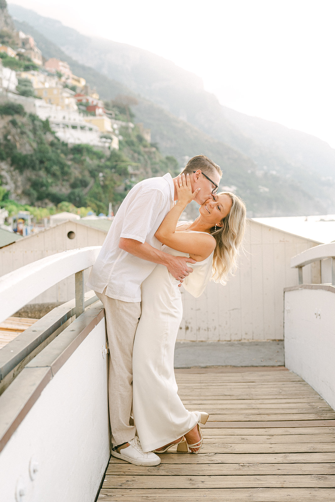 Engagement photographer capturing candid moments in Positano