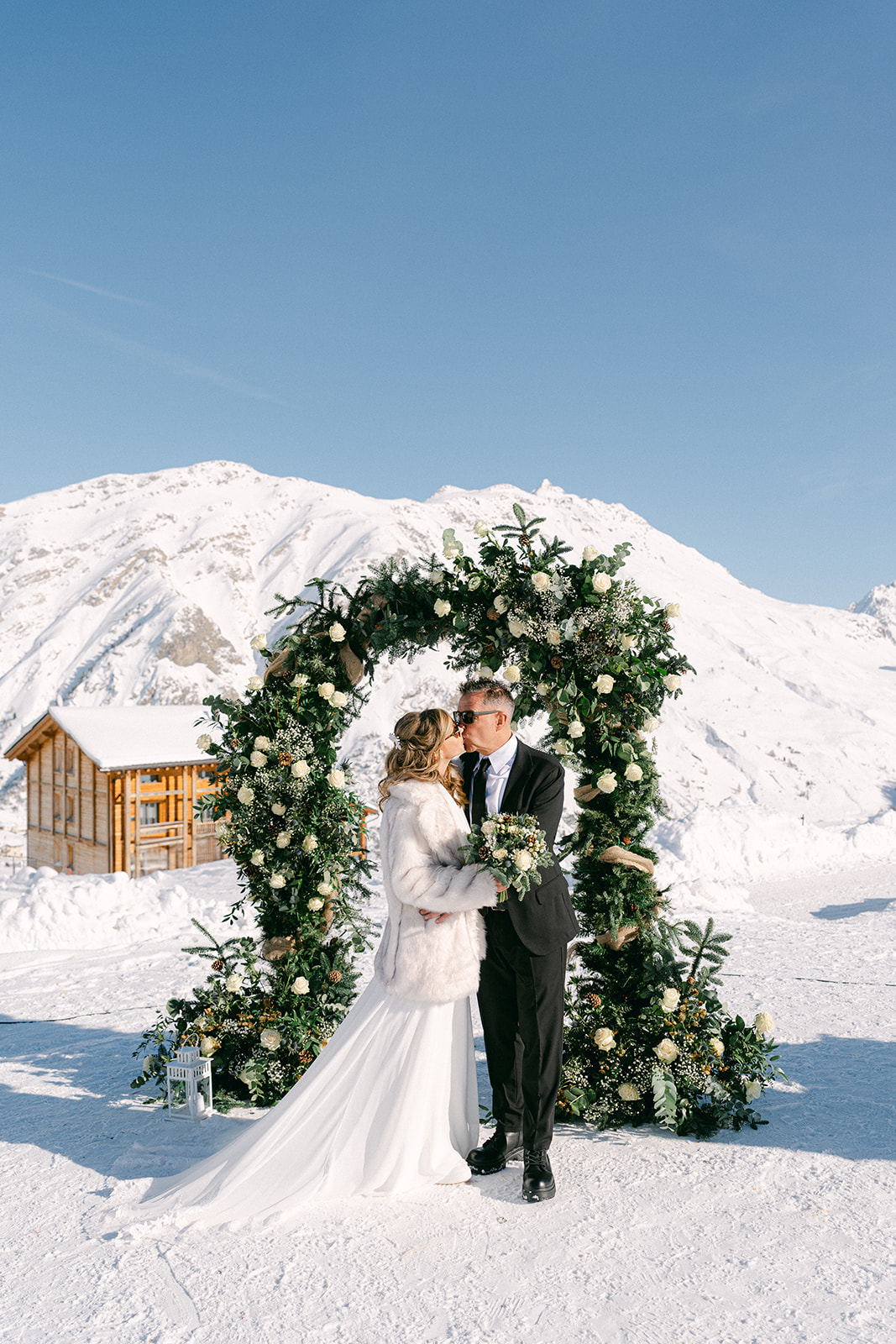 Couple exchanging vows at a high-altitude Italian mountain chapel