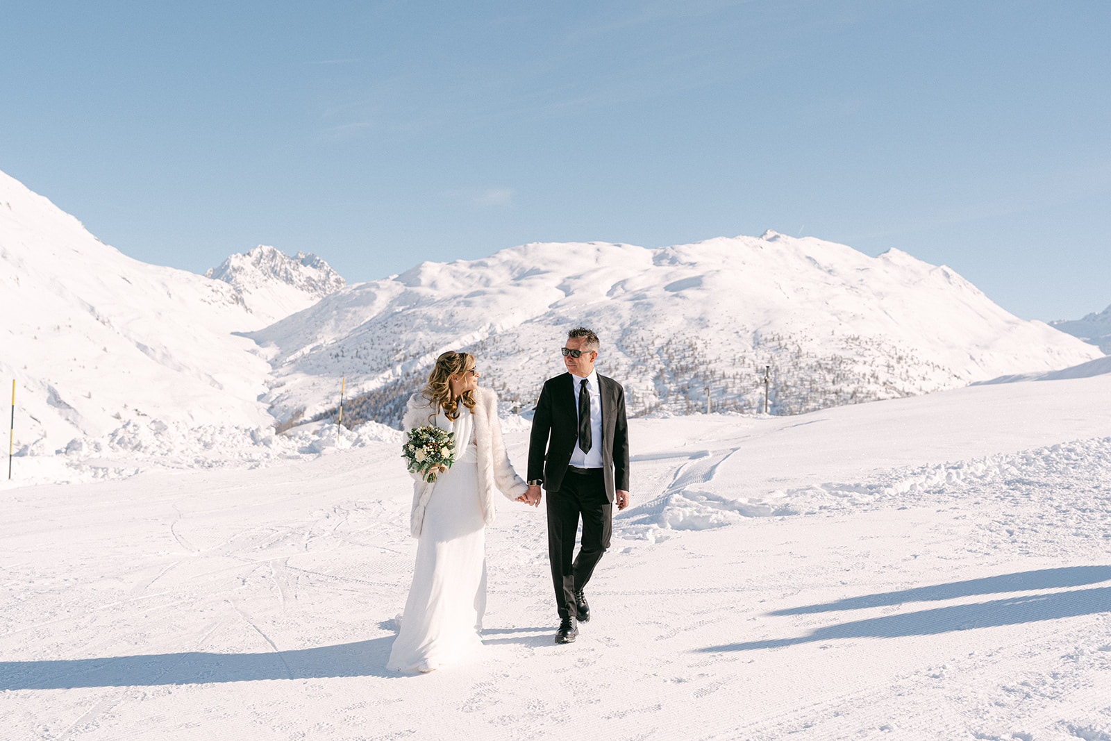 Bride and groom portraits during a winter wedding in the Italian Alps