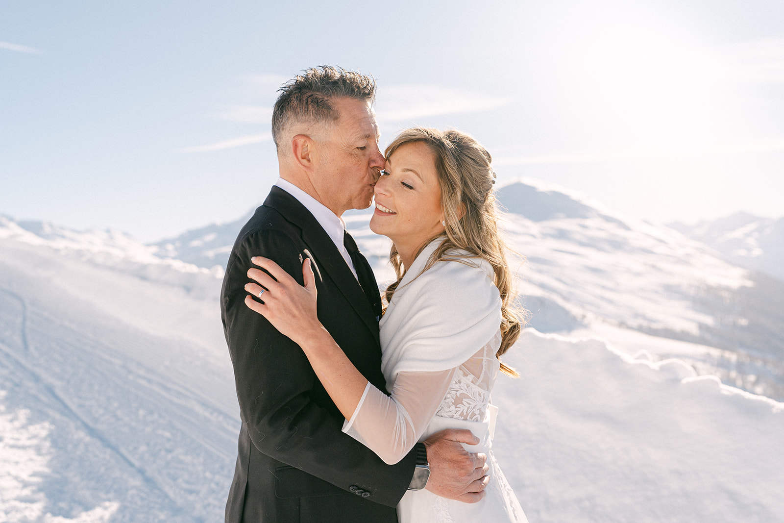 Romantic candid wedding photography in the snowy Alps, Italy