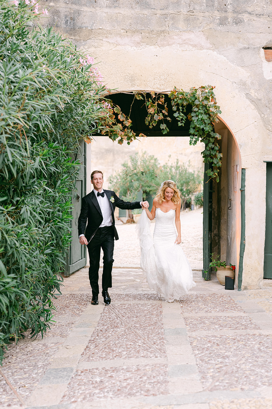 Bride and groom entering the outdoor wedding ceremony