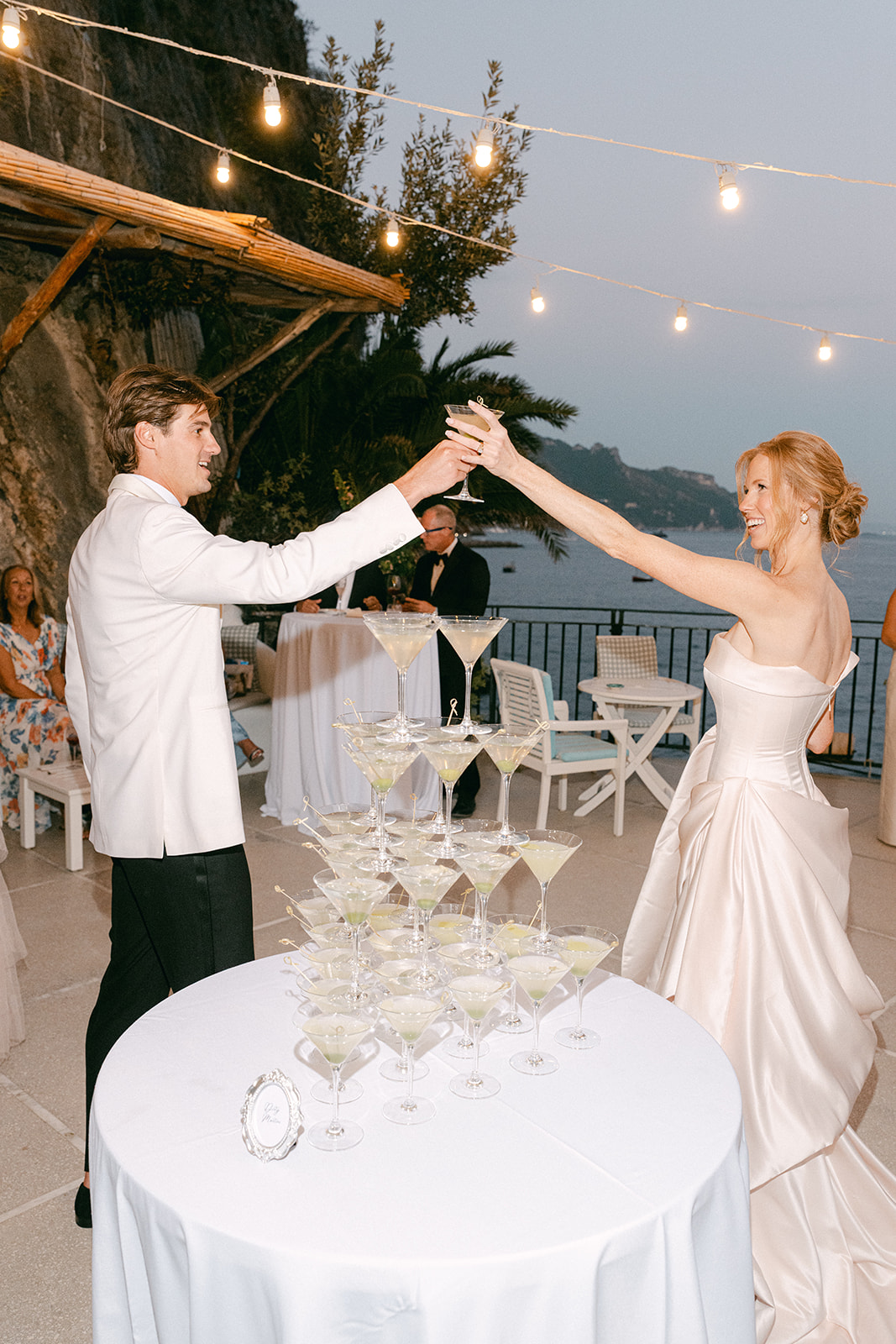 Fun twist on champagne tower — elegant dirty martini tower moment.