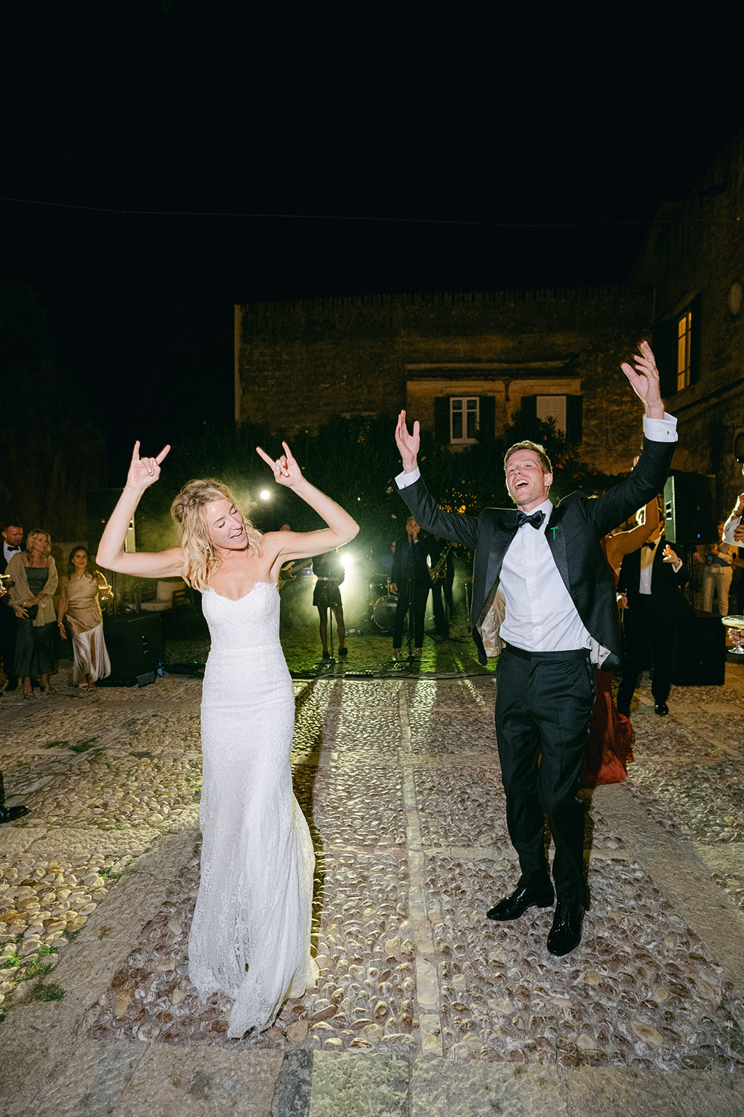 Dance floor moment with friends celebrating under the night sky at this outdoor wedding in Sicily.