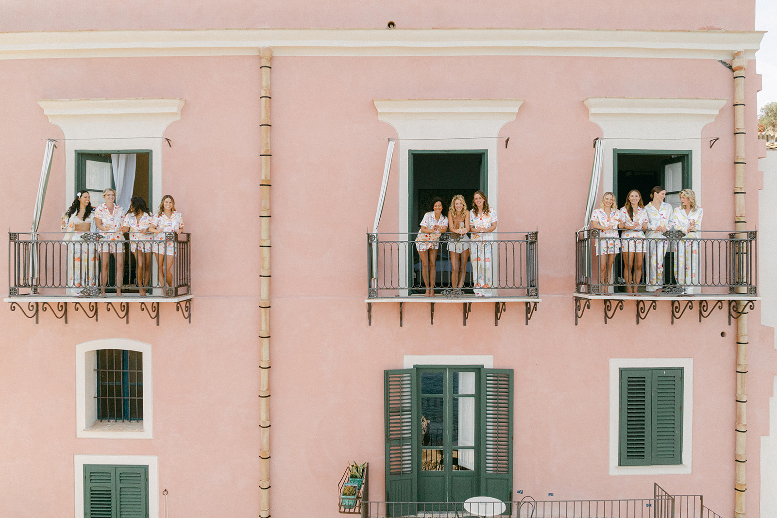 bride and bridesmaids getting ready photos int he balcony of Tonnara di Scopello